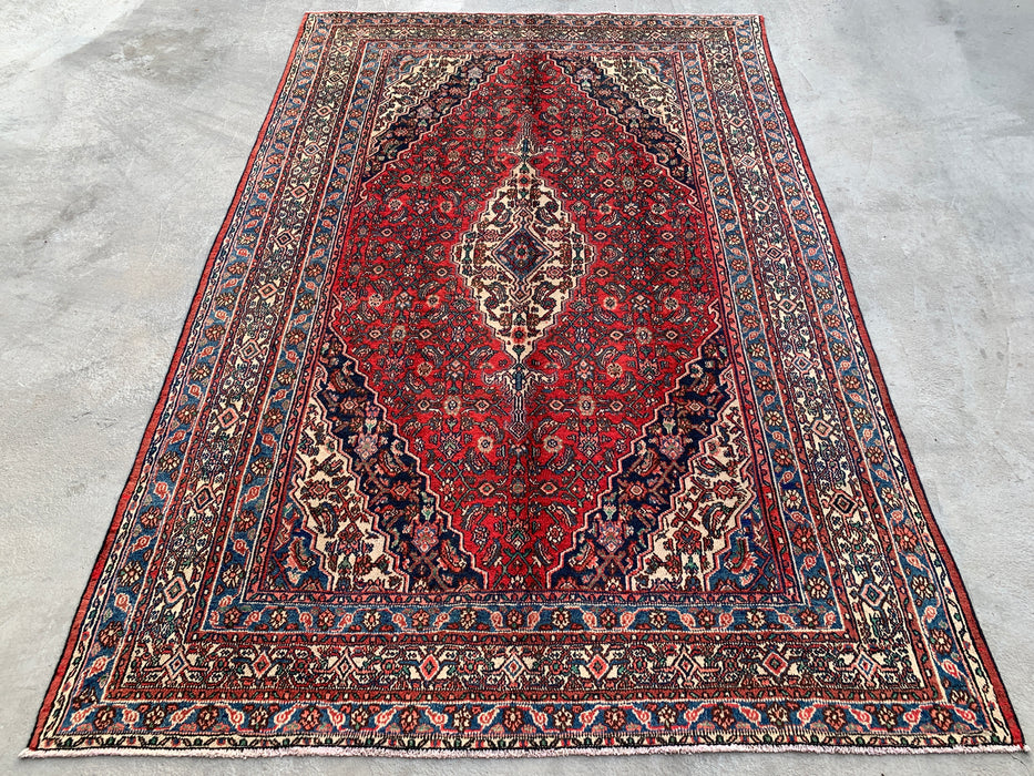Handgemaakt Perzisch wollen vloerkleed 7x10 - Rood, blauw en ivoorkleurig traditioneel Perzisch kleed met geometrisch medaillon - Exacte afmetingen 10'5" x 7'0" - KBHM-1038