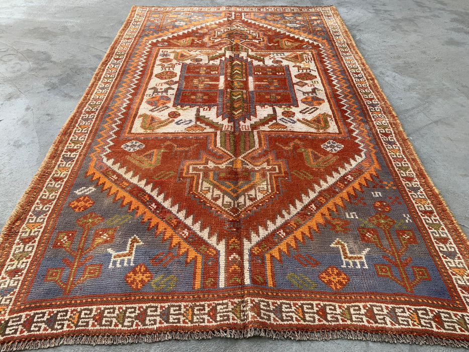 Handgeknoopt Perzisch wollen vloerkleed 221 x 140 cm roestkleurig ivoor tribaal medaillonkleed KBHM-1161