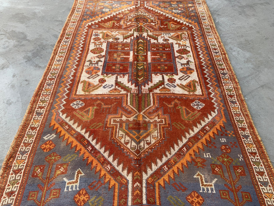 Handgeknoopt Perzisch wollen vloerkleed 221 x 140 cm roestkleurig ivoor tribaal medaillonkleed KBHM-1161