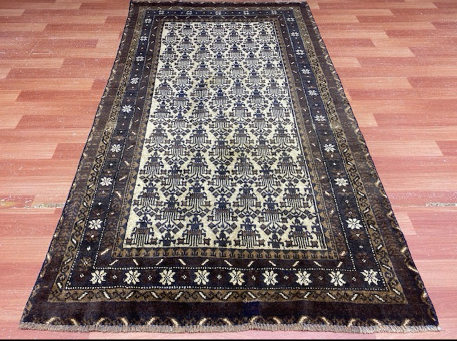 100 × 175 cm handgeknoopt Baluch wollen tapijt – Ivoor & Indigo geometrisch motief