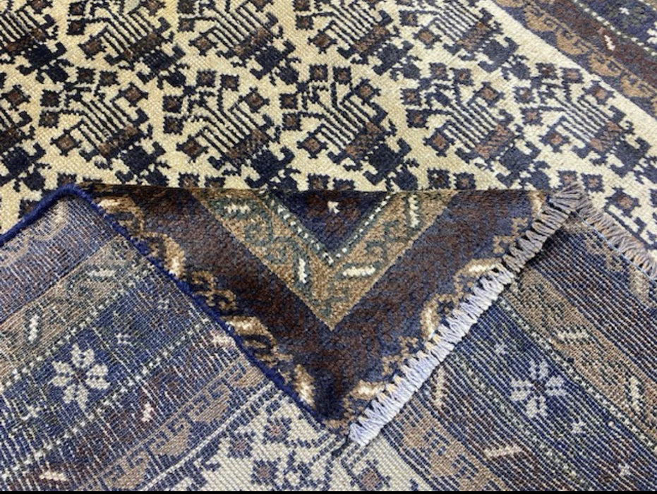 100 × 175 cm handgeknoopt Baluch wollen tapijt – Ivoor & Indigo geometrisch motief