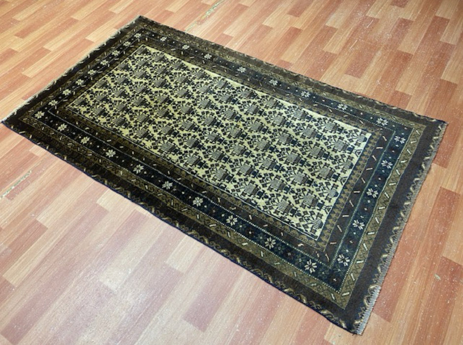 100 × 175 cm handgeknoopt Baluch wollen tapijt – Ivoor & Indigo geometrisch motief