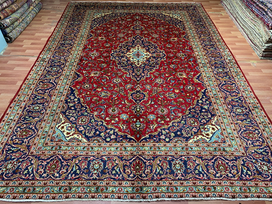 10'0" × 14'4" Handgeknoopt wollen tapijt – Rood medaillon met marineblauwe rand