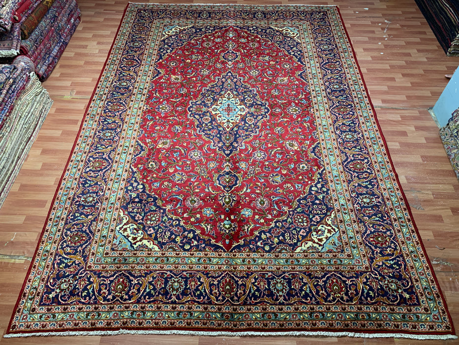 10'0" × 14'4" Handgeknoopt wollen tapijt – Rood medaillon met marineblauwe rand