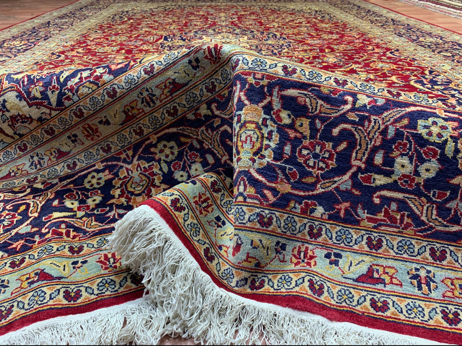 9'6" × 13'10" Handgeknoopt Perzisch wollen tapijt – Rood veld met marineblauwe & ivoorkleurige bloemenrand