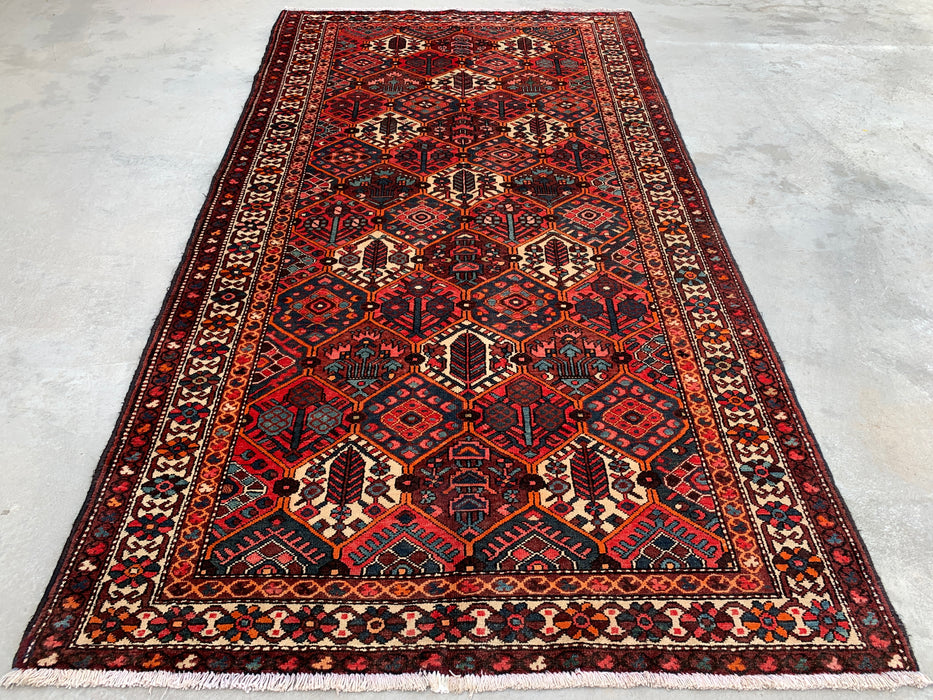 Handgemaakt Perzisch wollen vloerkleed 7x10 - Rood geometrisch tribaal Perzisch stijl kleed met ivoorkleurige rand - Exacte afmeting 9'10" x 5'3" - KBHM-835
