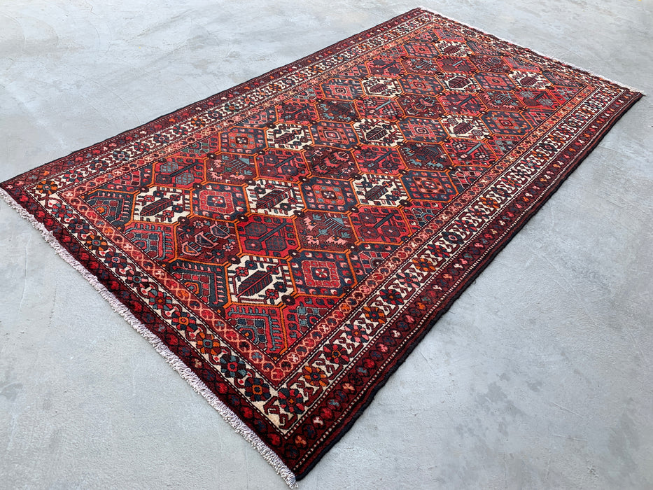 Handgemaakt Perzisch wollen vloerkleed 7x10 - Rood geometrisch tribaal Perzisch stijl kleed met ivoorkleurige rand - Exacte afmeting 9'10" x 5'3" - KBHM-835