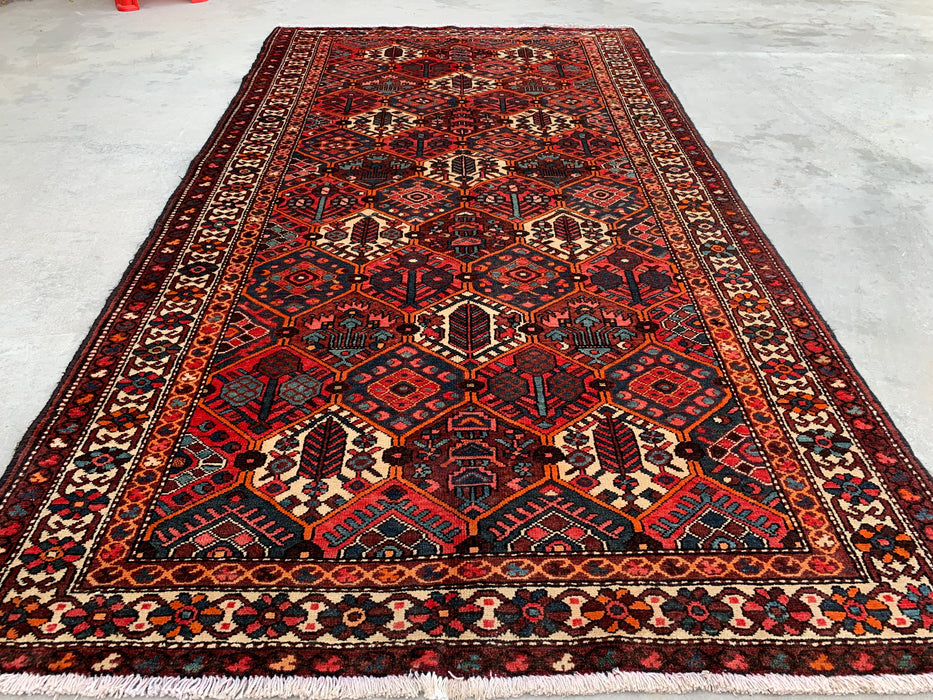 Handgemaakt Perzisch wollen vloerkleed 7x10 - Rood geometrisch tribaal Perzisch stijl kleed met ivoorkleurige rand - Exacte afmeting 9'10" x 5'3" - KBHM-835