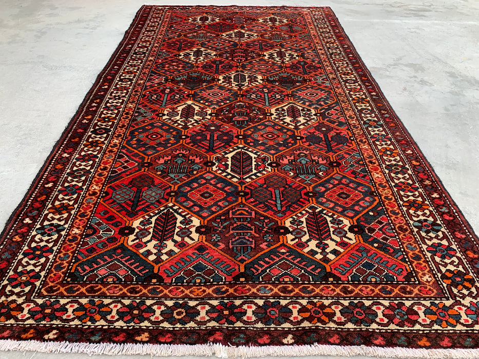 Handgemaakt Perzisch wollen vloerkleed 7x10 - Rood geometrisch tribaal Perzisch stijl kleed met ivoorkleurige rand - Exacte afmeting 9'10" x 5'3" - KBHM-835