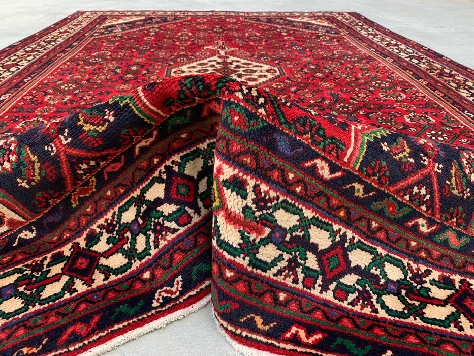 Handgemaakt Perzisch wollen vloerkleed 7x10 - Rood Perzisch tapijt met geometrisch medaillon en ivoorkleurige rand - Exacte afmeting 9'10" x 6'8" - KBHM-843