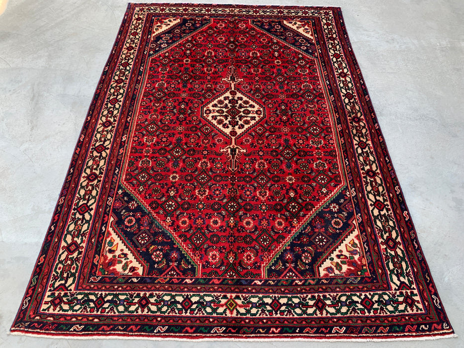 Handgemaakt Perzisch wollen vloerkleed 7x10 - Rood Perzisch tapijt met geometrisch medaillon en ivoorkleurige rand - Exacte afmeting 9'10" x 6'8" - KBHM-843