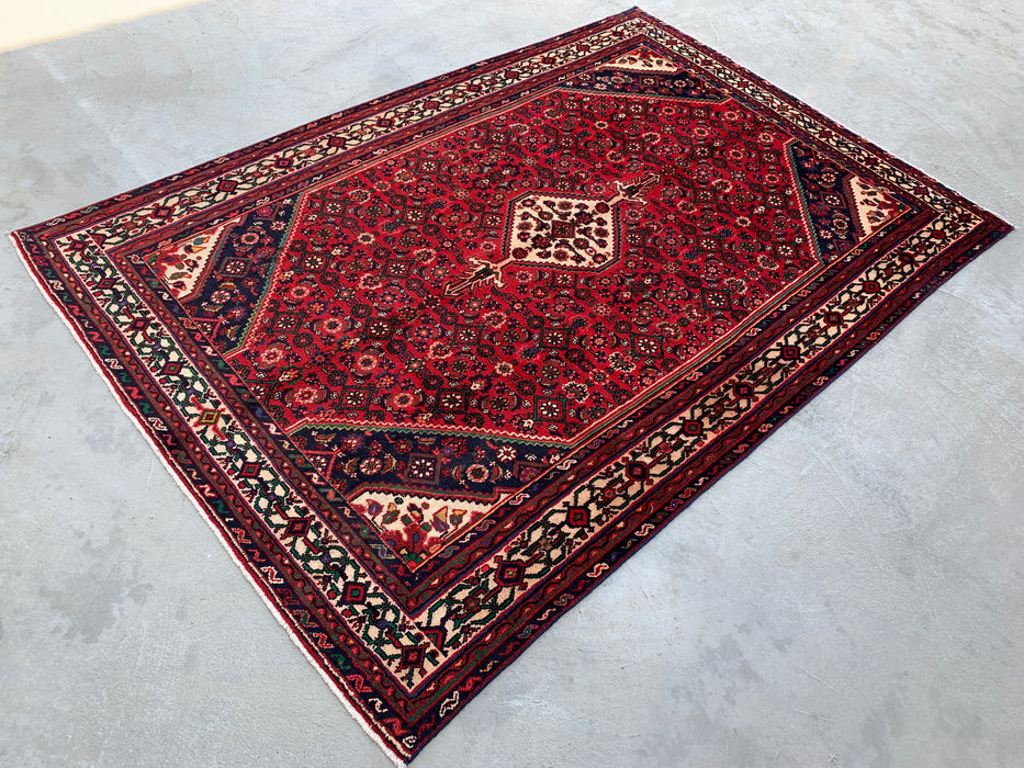 Handgemaakt Perzisch wollen vloerkleed 7x10 - Rood Perzisch tapijt met geometrisch medaillon en ivoorkleurige rand - Exacte afmeting 9'10" x 6'8" - KBHM-843