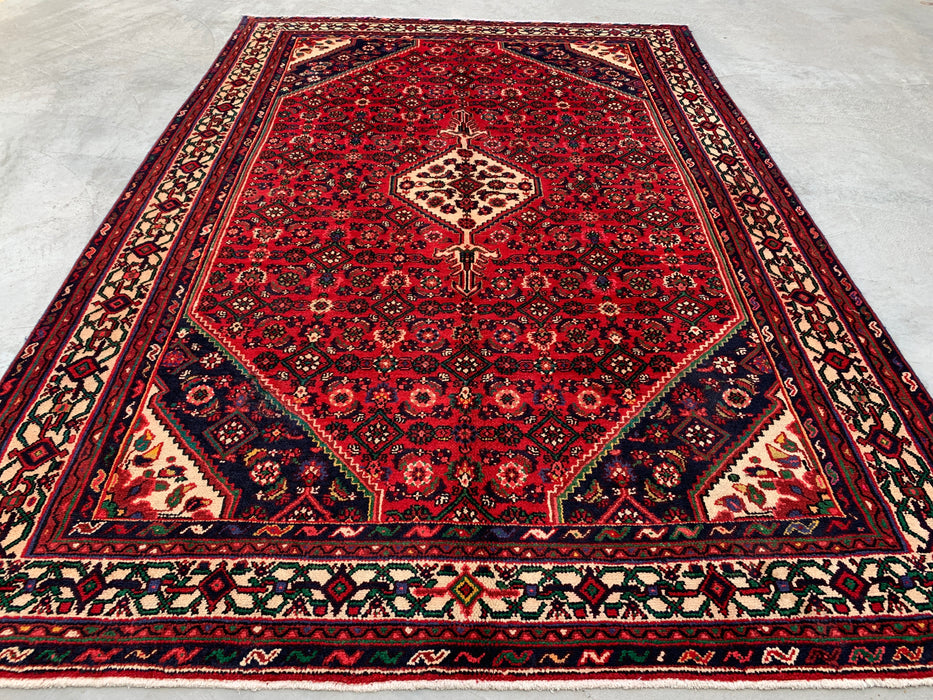 Handgemaakt Perzisch wollen vloerkleed 7x10 - Rood Perzisch tapijt met geometrisch medaillon en ivoorkleurige rand - Exacte afmeting 9'10" x 6'8" - KBHM-843