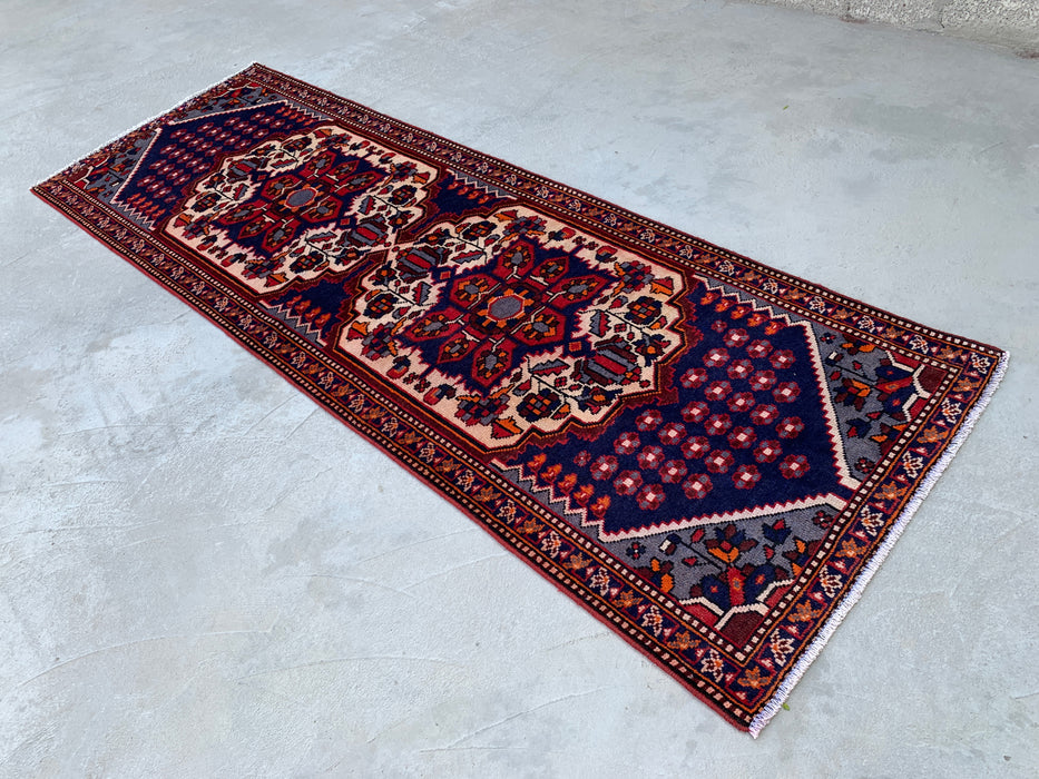 277 x 104 cm handgeknoopt Perzisch wollen loper - Marineblauw tribaal medaillonmotief met ivoorkleurige accenten - KBHM-868
