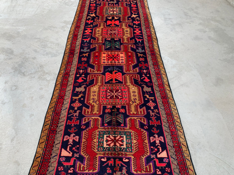295 cm x 112 cm handgeknoopt Perzisch wollen loper - Marineblauw tribaal geometrisch paneelontwerp met rode accenten - KBHM-896
