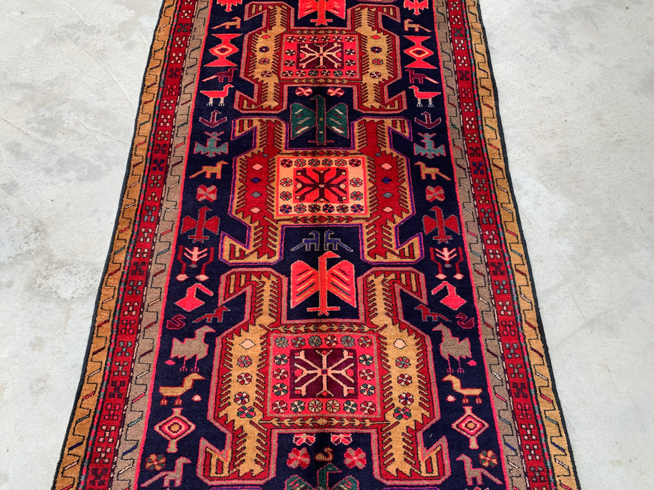 295 cm x 112 cm handgeknoopt Perzisch wollen loper - Marineblauw tribaal geometrisch paneelontwerp met rode accenten - KBHM-896