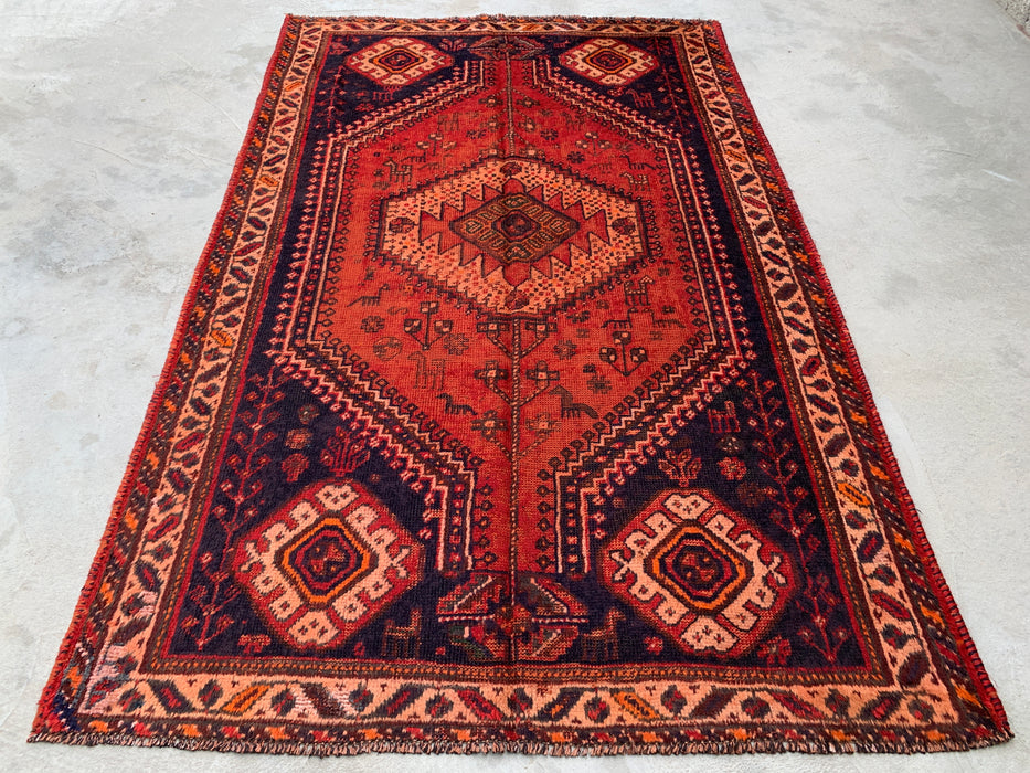 236 cm x 124 cm Handgeknoopt Perzisch wollen tapijt - Roestkleurig tribaal medaillonmotief met marineblauwe accenten - KBHM-901