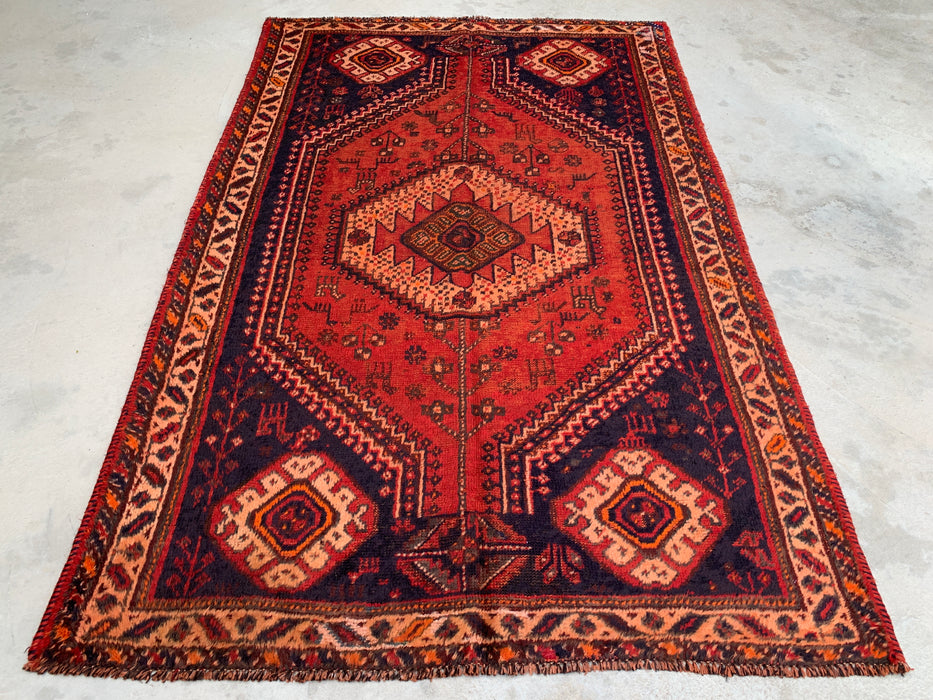 236 cm x 124 cm Handgeknoopt Perzisch wollen tapijt - Roestkleurig tribaal medaillonmotief met marineblauwe accenten - KBHM-901
