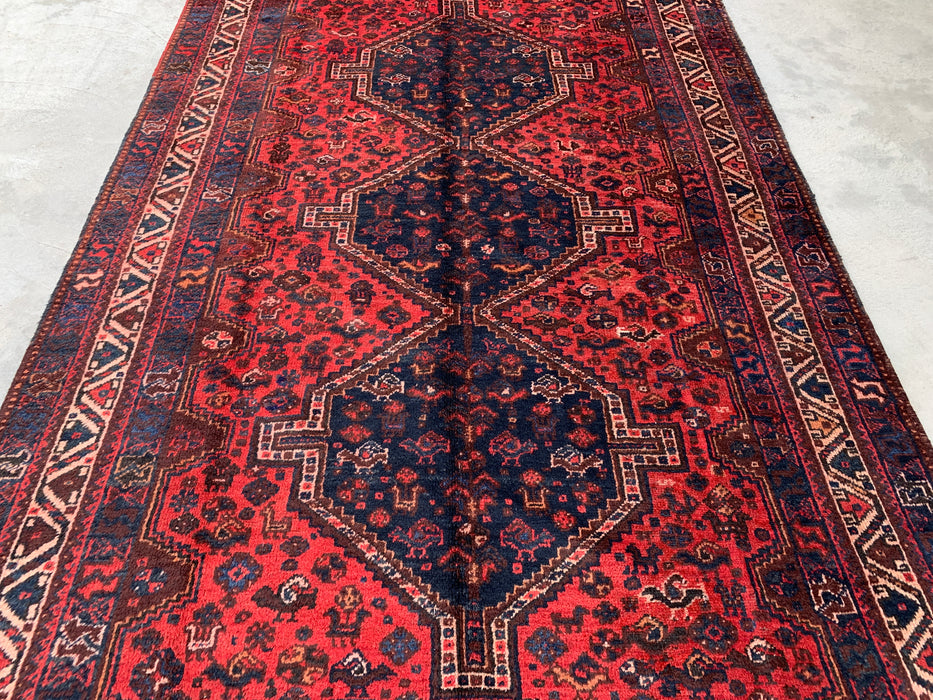 Handgemaakt Perzisch wollen vloerkleed 210x300 cm - Rood Perzisch tapijt in tribale stijl met medaillon en marineblauwe accenten - Exacte afmetingen 292 cm x 196 cm - KBHM-905
