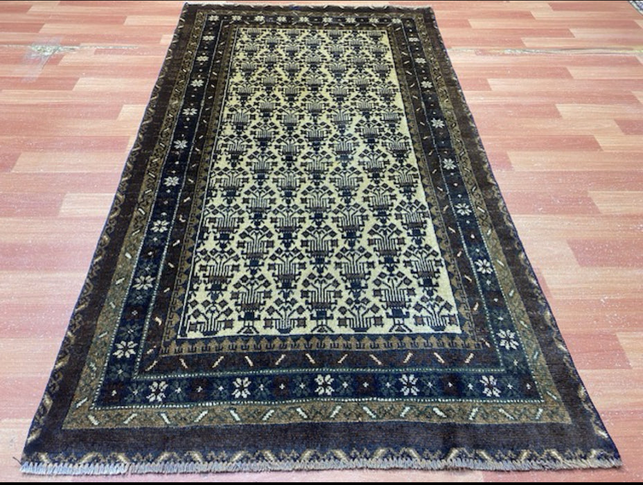 100 × 175 cm handgeknoopt Baluch wollen tapijt – Ivoor & Indigo geometrisch motief